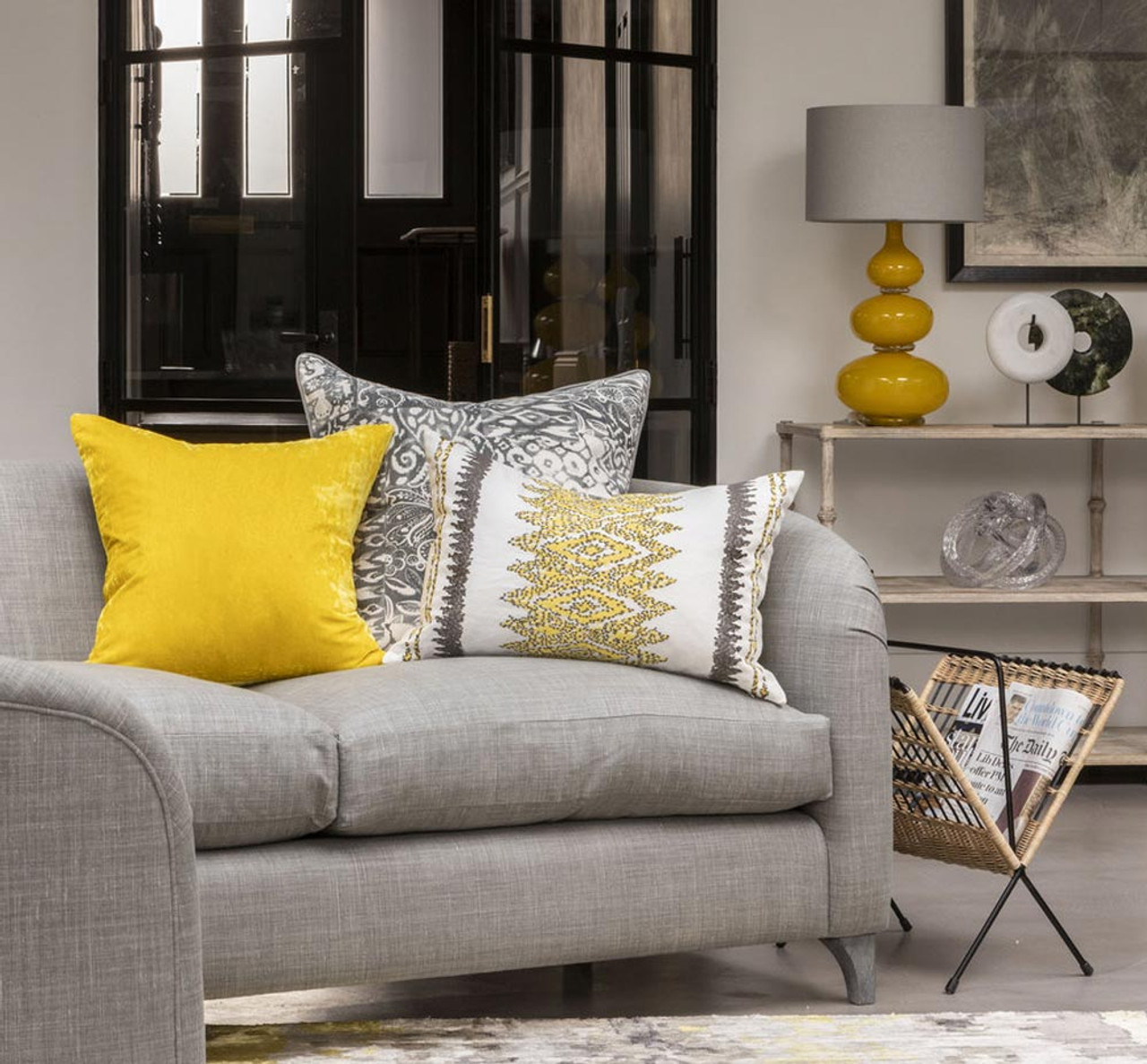 grey sofa with gold decor        <h3 class=