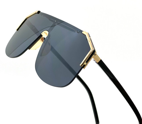 shield sunglasses, oversized sunglasses, fashion sunglasses, visor sunglasses, designer sunglasses, statement sunglasses, women's sunglasses, trendy sunglasses, modern sunglasses, gradient lenses, black sunglasses, gold sunglasses, sun protection