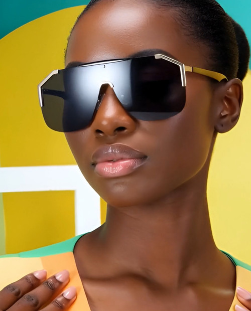 shield sunglasses, oversized sunglasses, fashion sunglasses, visor sunglasses, designer sunglasses, statement sunglasses, women's sunglasses, trendy sunglasses, modern sunglasses, gradient lenses, black sunglasses, gold sunglasses, sun protection