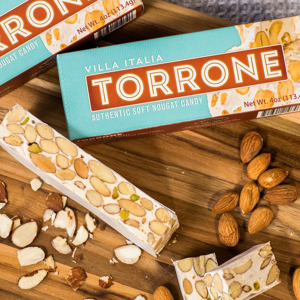 Torrone – Soft Italian Nougat with Almonds & Pistachios, Made with Local Honey

Experience the authentic taste of handmade Italian Torrone from Villa Italia Bakery. Our soft nougat is crafted using local honey, fresh egg whites, sugar, and premium California almonds and pistachios for a rich, chewy texture and perfectly balanced sweetness.

This gourmet Italian candy is a beloved choice for holidays, weddings, dessert boards, and gifting. Its soft bite and natural honey flavor make it one of the most traditional Italian confections—now available for nationwide delivery.