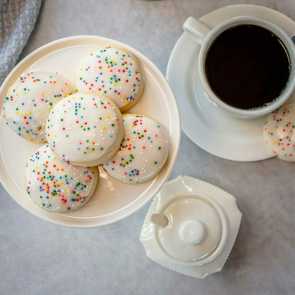 Rosette Cookies – Soft Italian Cookies with Fondant Icing & Rainbow Sprinkles (10-Pack)

Taste the cookie that made Villa Italia Bakery famous. Our Rosette Cookies are soft, citrus-kissed Italian cookies topped with a smooth, sweet fondant icing and colorful rainbow sprinkles. Baked fresh and packed with care, this 10-pack features our best-selling cookie—beloved in New York’s Capital Region for nearly 60 years.

Perfect for parties, holidays, birthdays, corporate gifts, or everyday snacking, these iconic Italian bakery cookies stay soft and flavorful for days and ship beautifully nationwide.