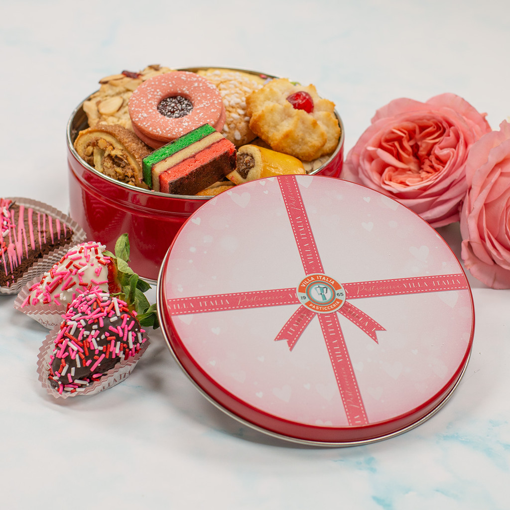 Villa Italia’s 1 lb Valentine’s Day cookie tin featuring an assortment of classic Italian cookies, paired with chocolate-dipped strawberries and festive Valentine desserts—perfect for gifting or sharing.