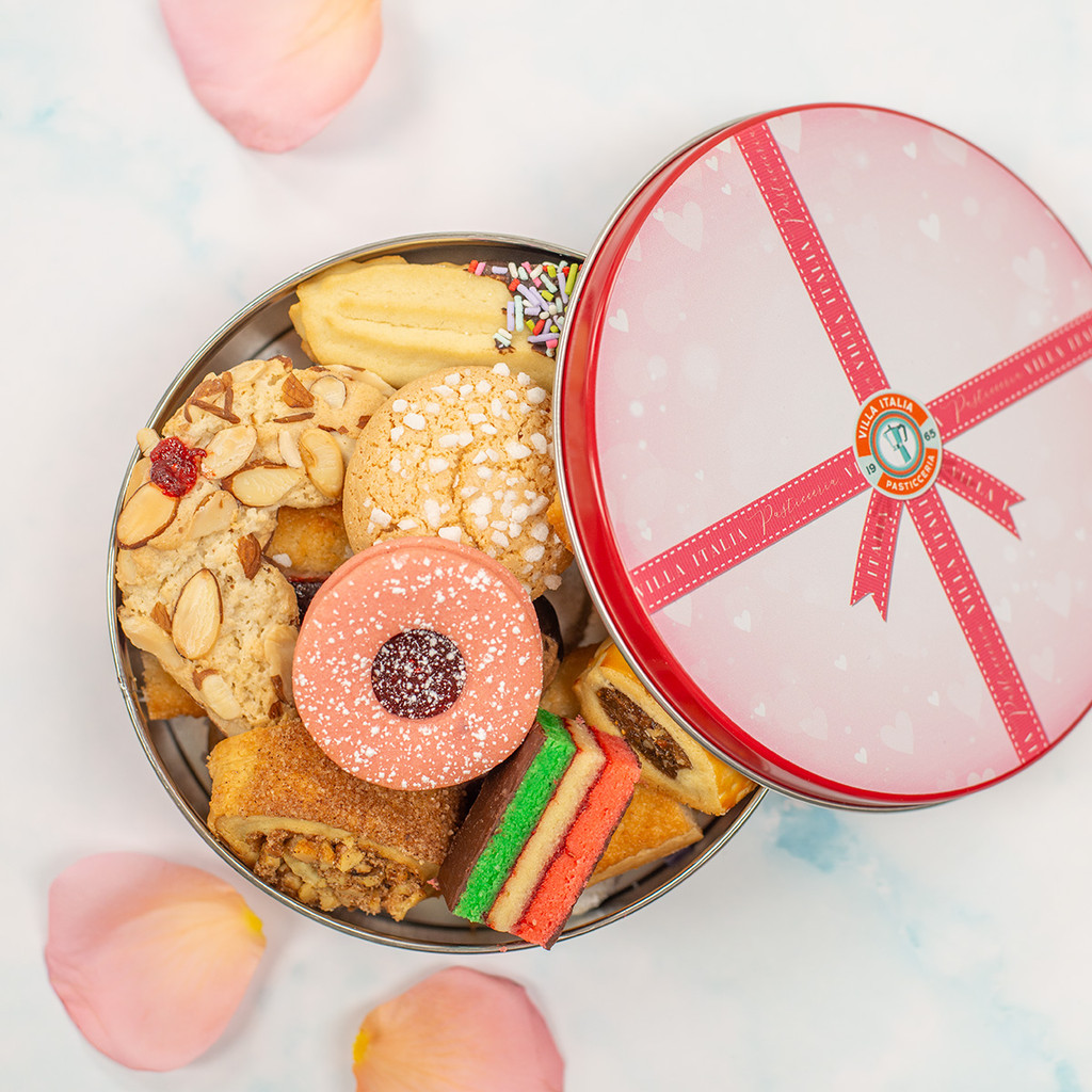 Villa Italia’s 1 lb Valentine’s Day cookie tin featuring an assortment of classic Italian cookies, paired with chocolate-dipped strawberries and festive Valentine desserts—perfect for gifting or sharing.
