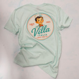 Bring home a piece of Villa Italia history with the exclusive Little Joe™ Collection T-Shirt. Made from the premium AS Colour 5001 Staple Tee, these 100% cotton shirts feature vintage-inspired Villa Italia artwork celebrating our Italian bakery heritage since 1965. Available in Butter, Pale Pink, and Seafoam, each design showcases Little Joe™ in classic Italian scenes, from cruising a vintage Fiat 500 to delivering sweet treats on a Vespa. Comfortable, durable, and perfect for Villa Italia fans, bakery lovers, and anyone who appreciates timeless Italian style. Shop the official Villa Italia Little Joe™ Collection today.