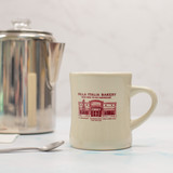 Bring home a piece of Villa Italia Bakery history with our Retro Diner Mug. This heavyweight ivory ceramic coffee mug features a vintage illustration of our iconic Italian bakery in Schenectady, New York — celebrating over 60 years of tradition.

Designed in classic 1950s diner style, this sturdy ceramic mug is perfect for coffee, espresso, cappuccino, or hot chocolate. Whether you’re pairing it with our famous coffee cake or gifting it to a coffee lover, this nostalgic bakery mug adds timeless charm to any kitchen.

• Heavyweight ivory ceramic
• Classic retro diner shape
• Vintage Villa Italia Bakery artwork
• Perfect gift for coffee lovers
• Ships nationwide

Sweet Since ’65.