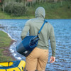 Man wearing the Sierra Designs Grotto 15L Cooler Sling