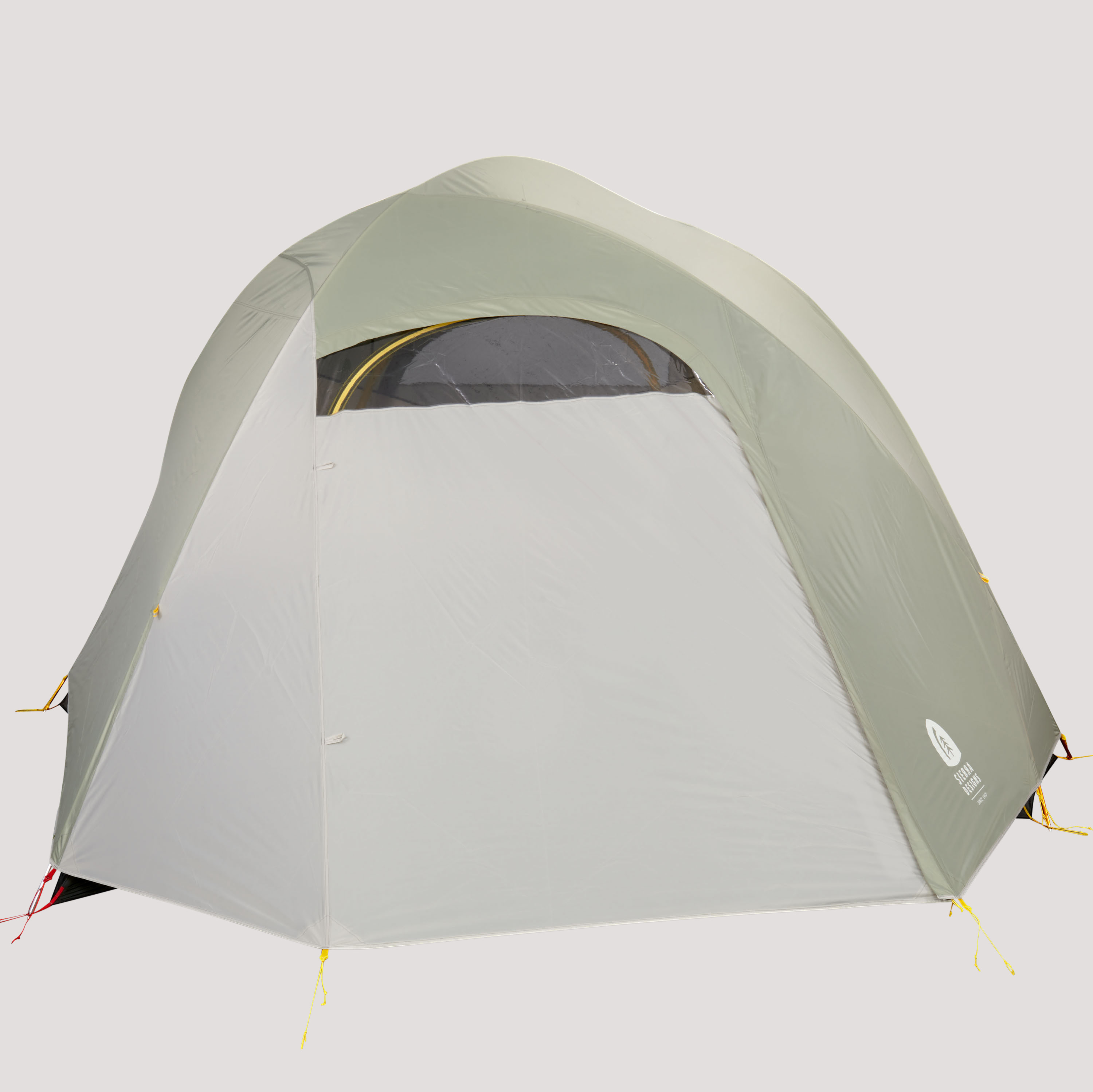 Sierra Designs Nomad 6 tent, white/green, front view, with fly attached and fully closed