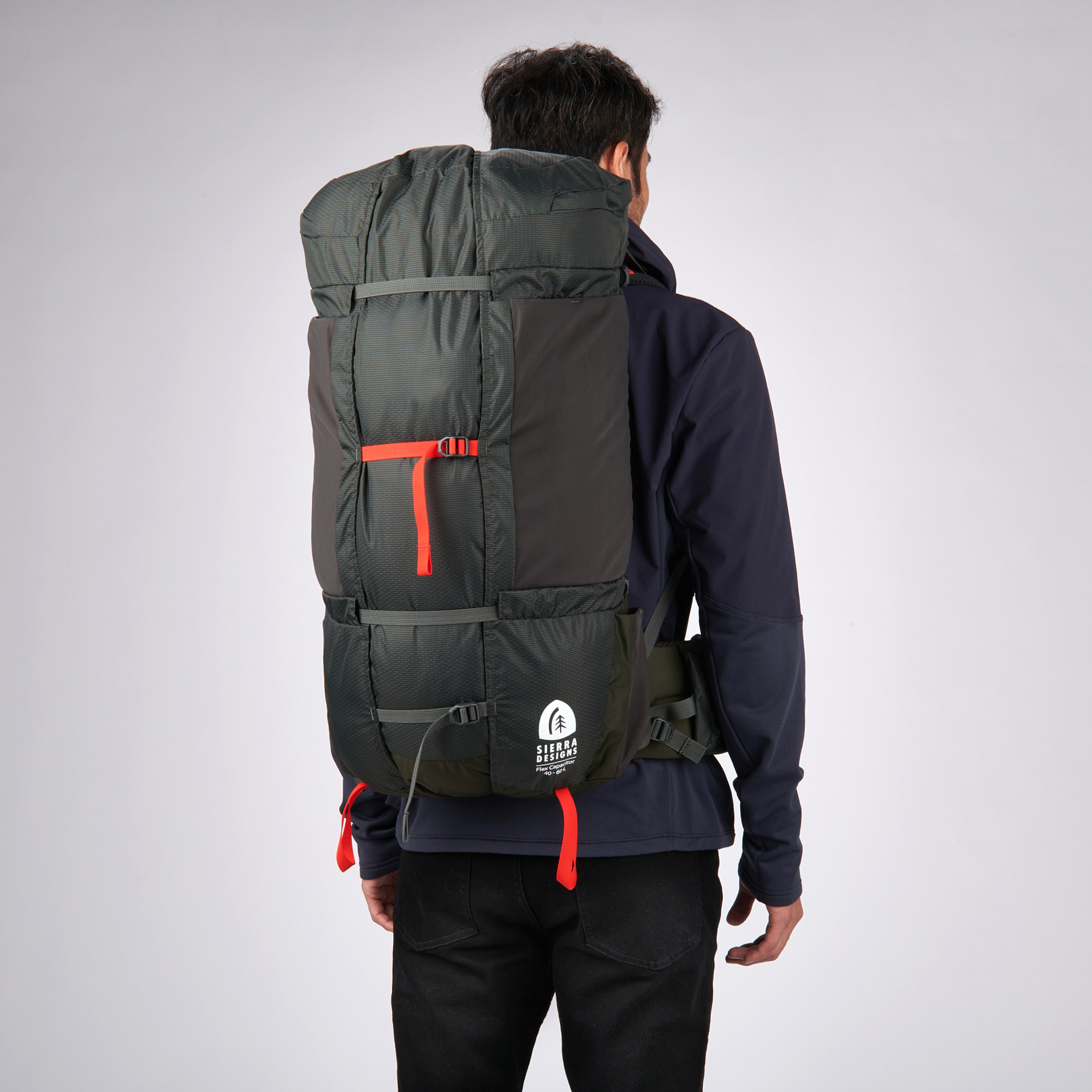 Man wearing Sierra Designs Flex Capacitor 40-60 backpack, Peat