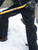 Person shovelling snow wearing Insulated Softshell Pants and Extreme Freezer gloves
