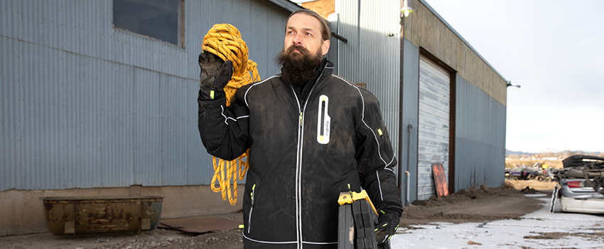 Man wears a subzero insulated jacket in cold weather.