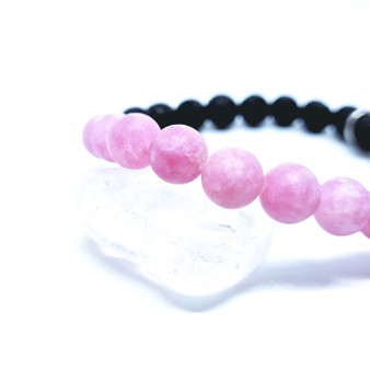 Purple Jade is white jade with a splash of purple! 

This raw crystal can provide laughter + light promoting a full spiritual awakening. Purple Jade is a crystal to help one heal their own emotional hurt. Acknowledging, feeling the whole feeling, accepting how you feel or felt and letting that feeling release from your body. Purple Jade encourages patience + diplomacy, inspires inner growth + maturity and helps one focus on considering love + wisdom in every thought. Purple Jade is a great crystal for empaths. 

Chakra: Heart + Crown