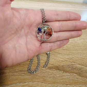 Tree of Life Chakra stone necklace. Stainless Steel 70cm chain with brass pendant with wire wrapped Chakra stones.

Perfect for focusing on yourself and connecting with each Chakra including; Root, Sacral, Solar Plexus, Heart, Throat, Third Eye and Crown.