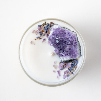 This beautifully hand made soy wax candle is the perfect choice if you’re wanting to gift a loved one ‘Harmony’. Showcasing an amazing Raw Amethyst Cluster softly surrounded by Polished Amethyst Gemstones. Depending on your chosen scent, organic dried flowers to top this recyclable solid glass vessel. This Crystal Candle has a long Burn Time of 44 hours. Arrives in a box ready to gift!