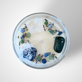 This beautiful hand made natural soy wax candle is the perfect choice if you’re wanting to gift a loved one wellness & good mental health. The bountiful combination of these gorgeous Tumbled Gemstones: Clear Quartz, Sodalite, Hematite, Fluorite & Fuchsite is positively beneficial to one’s mind, body & soul.  Scent of your choice for this Large 250g candle within a thick recyclable glass vessel. This candle is made with Love by Jodie of Crescent Moon Candles. Large Candles have a burn time of 44 hours.