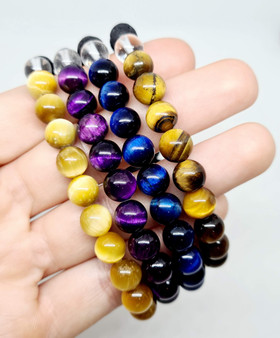 Quadrouple your self confidence, emotional strength and find your inner tiger energy with this set of four incredible Tiger Eye Aromatherapy Bracelets. This set includes: Natural Brown Gold Tiger Eye, Natural Yellow Tiger Eye, Blue Tiger Eye, Purple Tiger Eye. Perfect for gifting young adults, these crystals align with the energy of the Star Sign or Zodiac of Leo and are associated with the element of Fire. Handmade Crystal Jewellery made to size upon request.