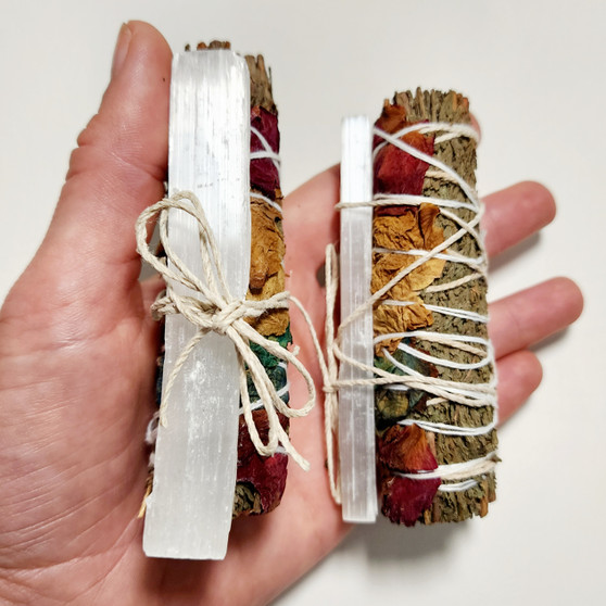 A Cedar Smudge is used for attracting positive energy + clearing negative energy. Providing the cleanser with strength + protection. Light end + blow out then wave smoke around the home or surround your crystal jewellery with the smoke. 13cm

Selenite is a form of gypsum used to remove energy blockages from items, crystals and people. Place near your jewellery every night to clear any negative energies, purify your space and increase clarity and inner peace. 13cm