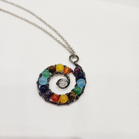 Chakra beads bound in antique copper wire spiral to provoke energy movement for healing. 70cm Surgical Grade Stainless Steel Chain.