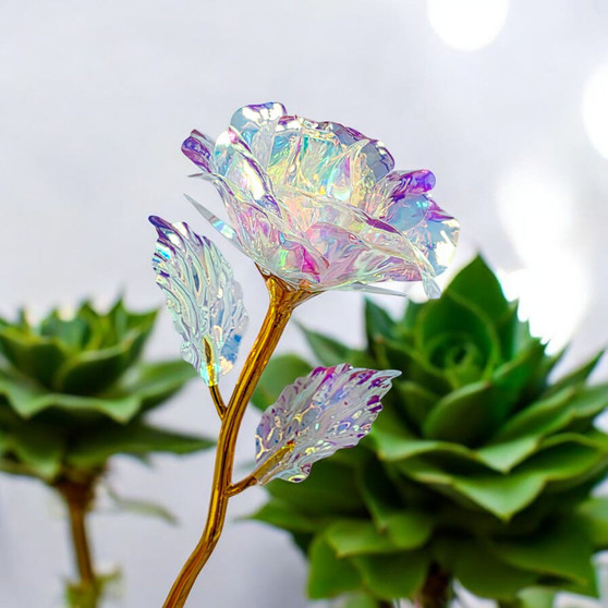 Artificial Rainbow Reflective Rose and leaves on Gold Rose Stem for sweet gifts of love to accompany your crystal order. These are created from a hard reflective cellophane material that ensures your gift of compassion is timeless.
