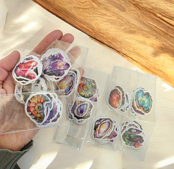 10 Pack of Crystal Stickers, White Border and backing. Stick to any surface, laptops, phones, books, interiors. These mixed variety stickers are approx 4x4cm. These make the cutest ADD ON to any special purchase!10 Pack of Crystal Stickers, White Border and backing. Stick to any surface, laptops, phones, books, interiors. These mixed variety stickers are approx 4x4cm. These make the cutest ADD ON to any special purchase!