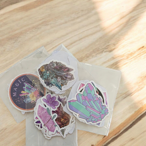 10 Pack of Crystal Stickers, White Border and backing. Stick to any surface, laptops, phones, books, interiors. These mixed variety stickers are approx 5-6cm. These make a very CUTE ADD ON to any special purchase!