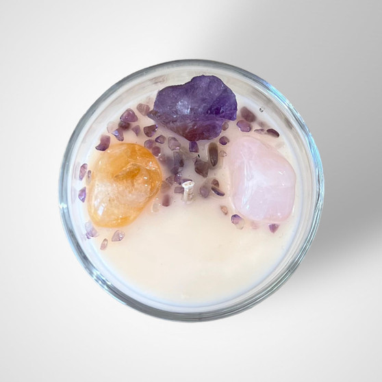 This beautifully hand crafted, natural soy wax candle is the perfect choice if you’re wanting to gift a loved one ‘Happiness & Joy’. The powerful combination of Amethyst, Citrine and Rose Quartz gemstones with Your Choice of scent will surround you or your loved one with energies filled with pure joy. Impressive 250g candle within a thick recyclable glass vessel. This candle is made with Love by Jodie of Crescent Moon Candles. Large Candles have a burn time of 44 hours.