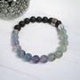 Fluorite is called the aura cleansing and stabilisation stone. Known to absorb and neutralises negative stress energies to increase concentration and focus as well as optimism, positivity and self-confidence. Fluorite's energy may bring together the mind and body for inner balance. Cleanse and set your intentions before you wear, see Care Instructions at Top Main Menu. Fluorites properties align with the Throat and Third Eye Chakras. Fluorite's properties compliment the personality traits of Zodiac Pisces and Capricorn. Combine this bracelet with our Eucalyptus + Lemon Oil Roller with Clear Quartz Shaker Gemstones. Roll onto black volcanic rock beads for aromatherapy benefits of your hand made bracelet.