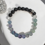 Fluorite is called the aura cleansing and stabilisation stone. Known to absorb and neutralises negative stress energies to increase concentration and focus as well as optimism, positivity and self-confidence. Fluorite's energy may bring together the mind and body for inner balance. Cleanse and set your intentions before you wear, see Care Instructions at Top Main Menu. Fluorites properties align with the Throat and Third Eye Chakras. Fluorite's properties compliment the personality traits of Zodiac Pisces and Capricorn. Combine this bracelet with our Eucalyptus + Lemon Oil Roller with Clear Quartz Shaker Gemstones. Roll onto black volcanic rock beads for aromatherapy benefits of your hand made bracelet.