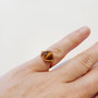 Hand made copper wire ring, made right here in QLD Australia. Enhance your personal power and strengthen your sense of self, your "inner strength". Tigers Eye is just a boost to self-confidence and self-esteem, coaxing out the courageous tiger that lies within your firey heart. Tigers Eye helps you in putting a stop to cycles of in-action, promoting decision making in all areas of your life. Reducing feelings of inadequacy or isolation & restoring your body's emotional balance through stability. Zodiac: Leo Chakra: Solar Plexus & sacral Mantra:  "I am confident & successful in every thing i do" Oil Roller: Madarin, orange, bergamot, lavender with Tiger Eye
