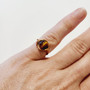 Hand made copper wire ring, made right here in QLD Australia. Enhance your personal power and strengthen your sense of self, your "inner strength". Tigers Eye is just a boost to self-confidence and self-esteem, coaxing out the courageous tiger that lies within your firey heart. Tigers Eye helps you in putting a stop to cycles of in-action, promoting decision making in all areas of your life. Reducing feelings of inadequacy or isolation & restoring your body's emotional balance through stability. Zodiac: Leo Chakra: Solar Plexus & sacral Mantra:  "I am confident & successful in every thing i do" Oil Roller: Madarin, orange, bergamot, lavender with Tiger Eye