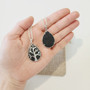 Spoil your Senses and Body as they receive essential oil essences from your own Tree of Life Lava Necklace. Black Volcanic Rock cooled, dried has bubbles throughout, as a result will hold onto Essential Oils that are added to the back of the pendant. Diffusing feelings of therapeutic relaxation.

Add one of our "Crystal Oil Rollers" to your Order so you can Get Started Right Away  Note: Lava has its own grounding and healing properties you may like to see our Lava Aromtherapy Bracelet for properties information. You may choose to leave the pendant Oil Free.