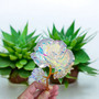 Artificial Rainbow Reflective Rose and leaves on Gold Rose Stem for sweet gifts of love to accompany your crystal order. These are created from a hard reflective cellophane material that ensures your gift of compassion is timeless.