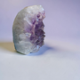 Quality Brazilian Amethyst Large point, upright cluster that features a breathtaking amount of quartz developed behind its purple teeth ? Polished and rounded outer edges with minimal raw rock behind. Majority of weight is high quality Amethyst to Calm your mind and soothe the soul into a more relaxed state - lets be real - your not coping or sleeping - so pick yourself up, buy Amethyst, focus on being relaxed for a short while and proceed at life once more ?❤️