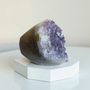 This Quality Brazillian Amethyst Cluster stands alone, weighing 366grams this purple Amethyst beauty has been preserved with as much as 7cm of supporting rock. This Amethyst Cluster has deep indigo purples within centre and bright rainbow violets towards her outer edges. Adopt this 8cm high Amethyst and enjoy the calming and healing properties of Amethyst at home.
Amethyst Properties
Clear your mind & relax with clarity. Amethyst is often worn when one seeks to find intuition in life, clarity about decisions & direction with divine communications. Widely known as good for headaches, the calming vibrational energy flows with you, encouraging peaceful sleep. It's deep indigo purple colour is one that you can easily get lost in, especially good for any fear of the dark. Amethyst's tranquil energy can be most beneficial to those with Obsessive Compulsive Disorder. Amethyst may bring a little inner calm to hyperactive children. It is also found helpful in bringing a gentle sense of comfort for thoughts when worn everyday. Amethyst is the Birthstone fro February. Cleanse and set your intentions before you wear. Amethyst aligns with the Third Eye Chakra. Amethyst closely aligns to the personality traits of Aquarius. Compliment your crystals with our Lavender Oil Roller with Amethyst Shaker Stones. Roll onto black volcanic rock beads for aromatherapy benefits. Also search Amethyst Ring.
