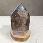 Smokey Quartz Properties: It is considered a premier grounding stone that helps balance the root chakra, promoting stability, security, and emotional balance. It is believed to help neutralize negative energy, alleviate fear, and reduce stress
Protection & Detoxification: Often used as a shield against electromagnetic smog (EMF) and geopathic stress. It is also believed to aid in letting go of old, negative patterns. Weighs 2.74kg Supplied by The Wilting Willows