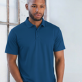 Male model wearing a royal plain CoolDry short sleeve polyester polo shirt (PS81)