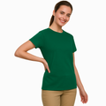 Young woman smiling, wearing a bottle grreen 100% cotton semi-fitted short sleeve t-shirt, perfect for custom printing or casual wear.