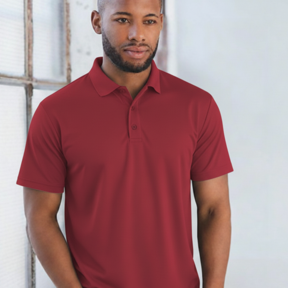 Male model wearing a maroon plain CoolDry short sleeve polyester polo shirt (PS81)