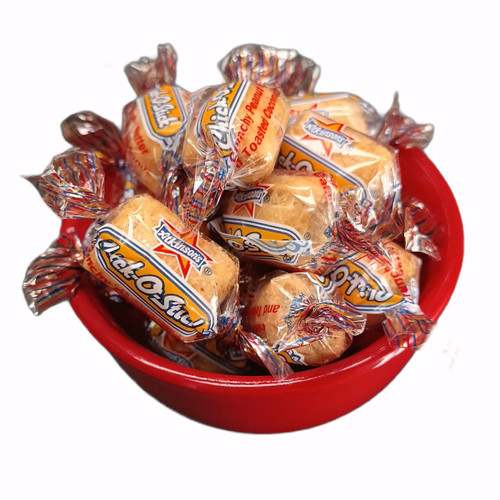 Individually wrapped Chick-O-Sticks displayed in a red bowl.