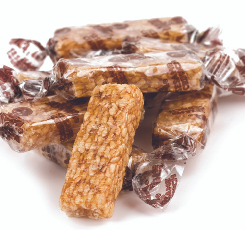 Individually wrapped Joyva Sesame Crunch bars showing the toasted sesame texture and crisp candy finish.