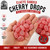 Handful of Claey's Sanded Cherry Drops displaying the candy size, bright cherry-red color, and classic sugar-sanded coating. Generous 2 lb bulk bag provides plenty of old-fashioned cherry hard candy for sharing, candy dishes, and everyday enjoyment.