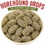 Close-up bowl of Claey's Sanded Horehound Drops highlighting the classic sanded sugar coating, oval shape, and authentic old-fashioned candy appearance loved by generations.