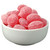 White bowl filled with round pink sugar-coated hard candies.