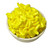 Bowl filled with bright yellow banana-shaped candies — glossy and vibrant.