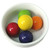 Bright, colorful Kaboom Jawbreakers in a clean white bowl — showcasing the glossy finish and bold candy colors.