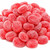 Pile of Claey's Sanded Cinnamon Drops featuring a vibrant red color, classic oval shape, and signature sugar-sanded coating. Sweet and spicy cinnamon hard candy with the traditional old-fashioned flavor candy lovers have enjoyed for generations.