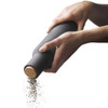 Using the upside-down grinder — AUDO Bottle Grinder dispensing pepper, beechwood knob detail.