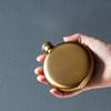 Izola 5oz round stainless steel flask matte gold | The Design Gift Shop