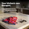 Front view of the BlueQ oven mitt with the slogan "Dear Wine, Yes" on a kitchen bench.