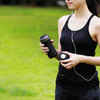 Woman exercising with a black THAT! ThermaCup MiniStore