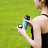 Woman carrying a sky blue water bottle by THAT! 